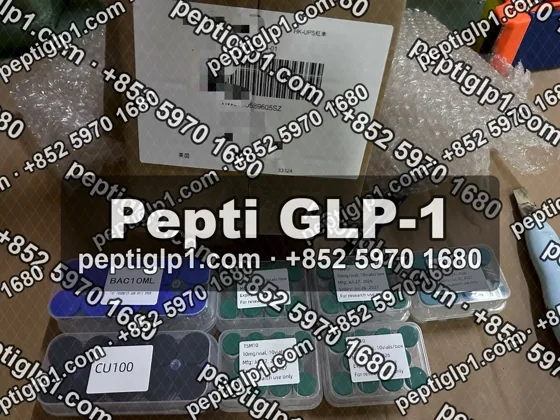 Pepti shipment photo, batch 1: lyophilized vial kits packed for courier collection, recipient details blurred